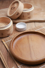 Dumplings on wooden plate and wooden table