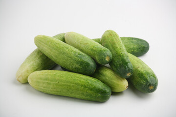 Piled of cucumbers on white background