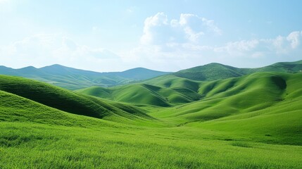 Obraz premium Vibrant green rolling hills under a clear sky creating a peaceful vista