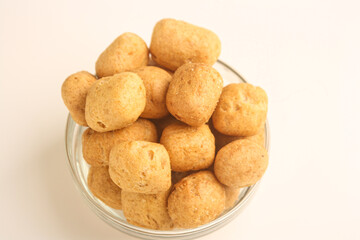 Fish crackers in glass bowl on white background