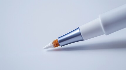 Naklejka premium Close up of a cosmetic teeth whitening pen with a brush tip isolated on a white background