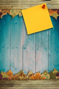 Fototapeta Autumn leaves with yellow note