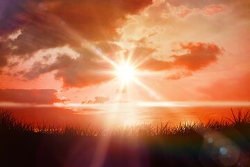 Obraz premium Digital composite of Sunrise over grass