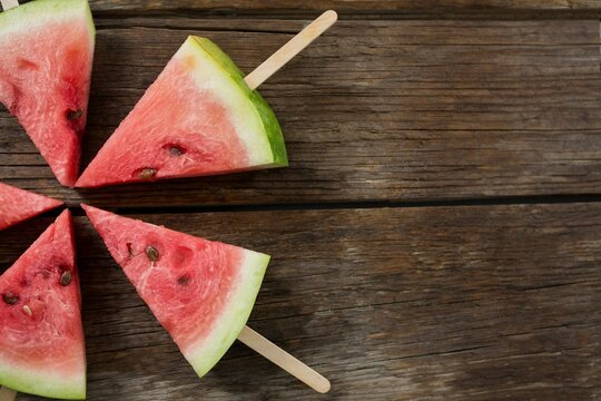 Fototapeta Watermelon posicles on wooden table