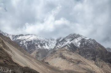 Majestic snow-covered Himalayan peak seen from Diskit Monastery in Nubra Valley, Ladakh — serene...