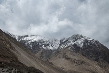 Majestic snow-covered Himalayan peak seen from Diskit Monastery in Nubra Valley, Ladakh — serene...