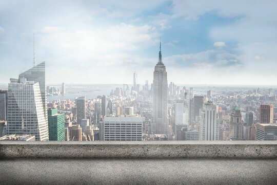Empire State Building is towering over flat design rooftop terrace, showing concrete ledge skyline