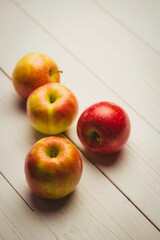 Fresh apples on wooden table