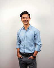 Fototapeta premium Confident Young Man in Casual Smart Outfit Posing Indoors