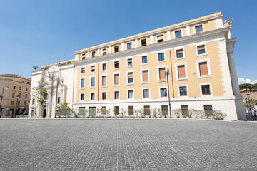 Domus Sanctae Marthae, the official residence within Vatican City, Rome, Italy, seen from an empty cobblestone square © Tropic Audiovisual