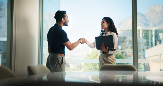 Happy, business people and meeting with handshake for greeting, introduction or welcome at office. Businessman, woman and shaking hands with smile for deal, partnership or agreement at workplace