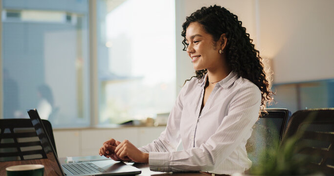 Lawyer, woman and laptop in office for research, advocate and case thinking. Legal aid, smile and online report for opportunity with attorney person with law firm, agency and reading legislation - Powered by Adobe