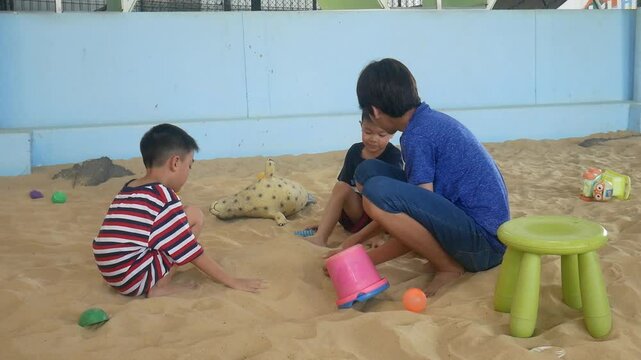 Children playing in the sand at the playground