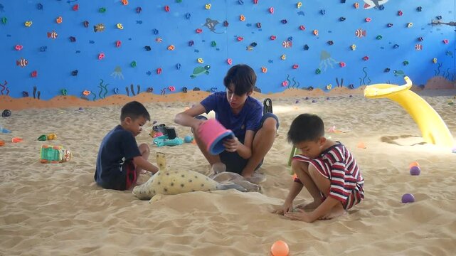 Children playing in the sand at the playground