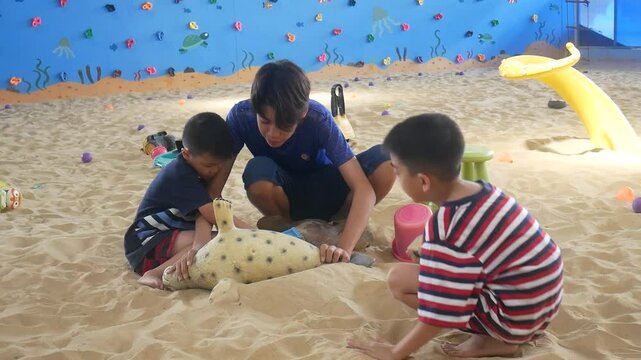 Children playing in the sand at the playground