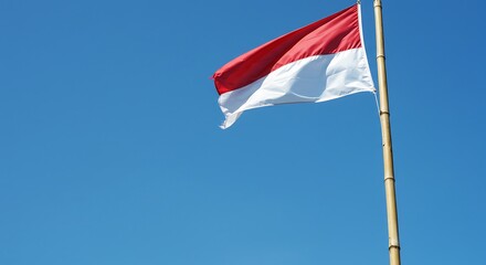 Indonesian Flag Waving in Clear Blue Sky A Symbol of National Pride