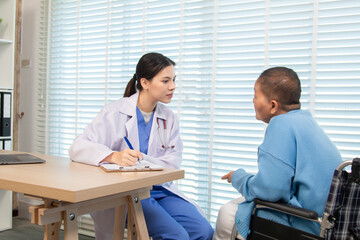 Fototapeta premium Female doctor consulting senior patient across table, pointing at laptop screen while discussing treatment plan in professional and friendly healthcare environment, illness, hospitality.