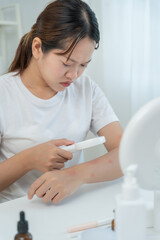 skin problem and beauty. asian woman use magnifying glass look itchy skin from skin allergic, shocked, steroid allergy, sensitive, chemical allergy, rash, insect bites, Seborrheic Dermatitis.