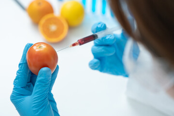 Scientist check chemical food residues in laboratory. Control experts inspect quality of fruit,...