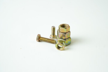 A collection of metal bolts and nuts arranged on a white background, displaying a variety of sizes...