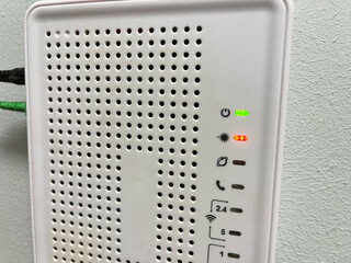 Close-up of a network switch on a wall in a room