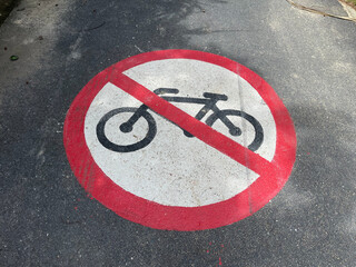 Bicycle sign on the road. No bike parking sign on the road.