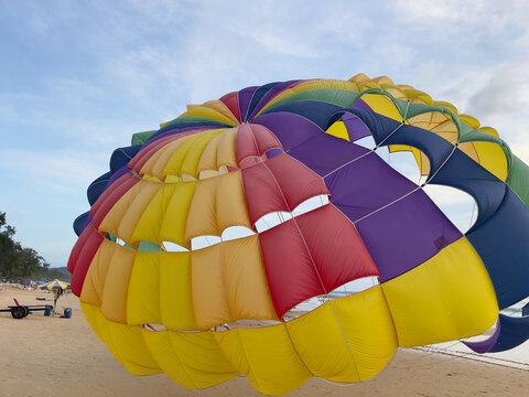 Parachutist flying on the beach in Phuket, Thailand