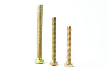 Metal bolts and nuts symmetrically arranged on a white background, representing precision,...