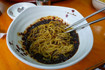 A bowl of Korean-style jajangmyeon with rich sauce and noodles perfectly combined.
