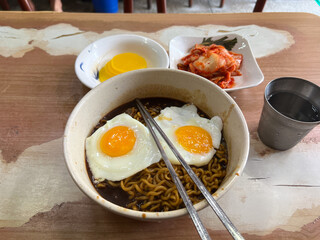 A bowl of Korean-style jajangmyeon with rich sauce and noodles perfectly combined.