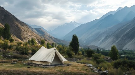 Tent set up in the mountains with a beautiful landscape surrounding it