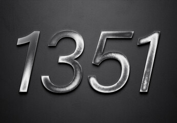 Chrome metal 3D number design of 1351 on grey background.