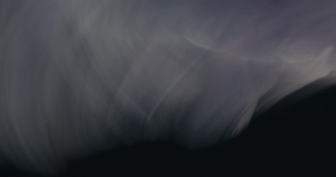 An abstract transition style shot of a rock spinning in a high frame rate.