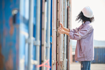 Worker or Engineer opening the container door in warehouse storage