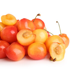 Heap of sweet yellow cherries on white background