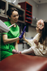 Smiling Nurse Gives High-Five to a Young Patient at a Modern Clinic