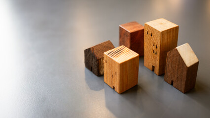 Wood house model on wood table , a symbol for construction , ecology, loan, mortgage, property or home.