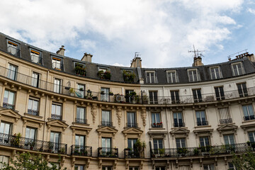 Obraz premium Curved Building Facade with Balconies and Windows