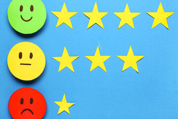 Rating smiles with stars on blue background. Customer experience concept