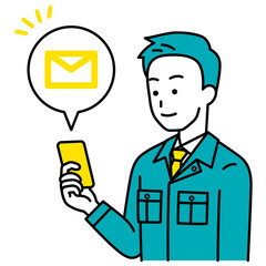 スマートフォンでメールを受信する作業員の男性