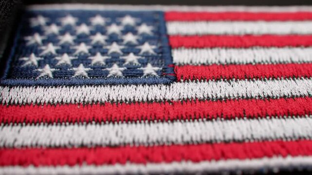 Detailed closeup of an embroidered U.S. flag patch.


