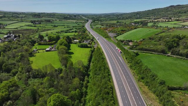 Aerial view of vehicles driving on A8 Larne road Dual carriageway, Ballymena road, Belfast road, Millbrook Larne Co Antrim Northern Ireland
