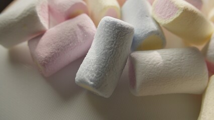 Close-up of pastel marshmallows with soft texture and warm lighting