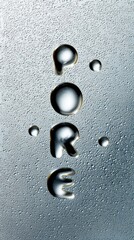 Water droplets forming the word 'PORE' against a backdrop of numerous smaller water droplets creating a textured surface