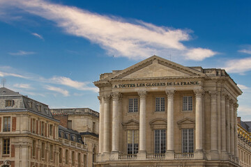 Naklejka premium Architectural Exterior of Building with Columns and Blue Sky at Versailles Gardens, Paris.