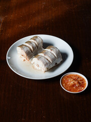 boiled Barracuda fish with chili dip sauce