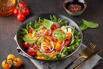 Easy salad of grilled salmon, fresh cucumber, tomato, sweet pepper, spinach leaves and onion ....