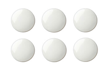 Six blank, round, white buttons/objects arranged in a grid