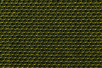 Texture of dense yellow fabric for tailoring. Canvas. Textile. Textile