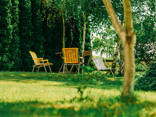 Yellow Folding Chairs in Summer Garden